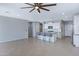 Open concept living area showcasing a kitchen island with bar seating and tile floors throughout at 4628 W Greenleaf Dr, San Tan Valley, AZ 85144