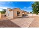 This backyard features low maintenance desert landscaping, a covered patio, and views of the community at 4639 E Cabrillo Dr, Gilbert, AZ 85297
