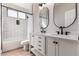 This bathroom features a double vanity with modern fixtures and subway tile in the shower and toilet area at 4639 E Cabrillo Dr, Gilbert, AZ 85297