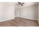 A bedroom offering light hardwood floors, neutral walls, base trim and a ceiling fan at 4639 E Cabrillo Dr, Gilbert, AZ 85297