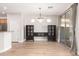 Bright dining area featuring hardwood floors, modern lighting, and access to the backyard through sliding glass doors at 4639 E Cabrillo Dr, Gilbert, AZ 85297
