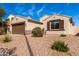 Charming single-story home with a brown two car garage, desert landscaping and a walkway to the front door at 4639 E Cabrillo Dr, Gilbert, AZ 85297