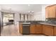 Bright kitchen showcasing stainless steel appliances, breakfast bar, with view into the dining and living areas at 4639 E Cabrillo Dr, Gilbert, AZ 85297