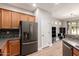 Spacious kitchen boasting stainless steel appliances, plenty of cabinet storage, and a breakfast bar at 4639 E Cabrillo Dr, Gilbert, AZ 85297