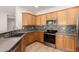 Kitchen featuring stainless steel appliances, neutral countertops, light wood cabinets and mosaic backsplash at 4639 E Cabrillo Dr, Gilbert, AZ 85297