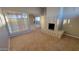 Living room featuring a classic fireplace, tile flooring, and glass sliding doors to the outside at 4721 N 55Th Dr, Phoenix, AZ 85031