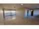 Spacious living room features tile flooring and large sliding glass doors at 4721 N 55Th Dr, Phoenix, AZ 85031