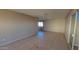 Spacious living room featuring tile flooring and large sliding glass doors at 4721 N 55Th Dr, Phoenix, AZ 85031