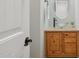 Bathroom featuring decorative sink, wood cabinets, granite countertop, and oval mirror at 4772 E Portola Valley Dr # 102, Gilbert, AZ 85297