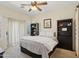 Comfortable bedroom with ceiling fan, plantation shutters, and access to the outdoor patio at 4772 E Portola Valley Dr # 102, Gilbert, AZ 85297