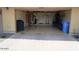 Garage featuring epoxy floors and storage space with an automatic door at 4772 E Portola Valley Dr # 102, Gilbert, AZ 85297