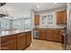 Open kitchen design featuring a large island with granite countertops, seamlessly connected to the living area at 4772 E Portola Valley Dr # 102, Gilbert, AZ 85297