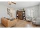 Bright living room featuring neutral walls, tile flooring, ceiling fan, and staircase to the second floor at 4772 E Portola Valley Dr # 102, Gilbert, AZ 85297