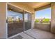 A private balcony offers outdoor living space, accessible through sliding glass doors at 5401 E Van Buren St # 3048, Phoenix, AZ 85008