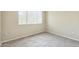 Cozy bedroom featuring neutral carpet and a window that lets in natural light at 5401 E Van Buren St # 3048, Phoenix, AZ 85008