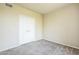 This bedroom offers neutral walls, soft carpet, and a spacious closet for ample storage at 5401 E Van Buren St # 3048, Phoenix, AZ 85008