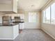 Bright kitchen and dining area with stainless steel appliances and a large window, offering scenic views at 5401 E Van Buren St # 3048, Phoenix, AZ 85008