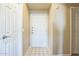 Bright entryway with tile flooring and a white front door creating a welcoming first impression at 5401 E Van Buren St # 3048, Phoenix, AZ 85008