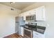 Bright kitchen with stainless steel appliances and white cabinets at 5401 E Van Buren St # 3048, Phoenix, AZ 85008