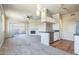 Inviting living space with an open layout, featuring a fireplace, a kitchen island, and plenty of natural light at 5401 E Van Buren St # 3048, Phoenix, AZ 85008