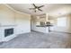 Spacious living space featuring a fireplace and an open kitchen area, perfect for entertaining at 5401 E Van Buren St # 3048, Phoenix, AZ 85008