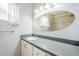 This bathroom has a large mirror over a vanity and a tiled shower at 5437 E Pinchot Ave, Phoenix, AZ 85018