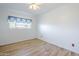 This bedroom is illuminated by a ceiling fan and a window for natural light at 5437 E Pinchot Ave, Phoenix, AZ 85018