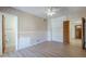 Bedroom featuring a ceiling fan, neutral wallpaper and built in storage at 5437 E Pinchot Ave, Phoenix, AZ 85018