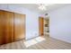 This bedroom offers tile flooring and a ceiling fan for comfort at 5437 E Pinchot Ave, Phoenix, AZ 85018