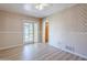Bedroom featuring a ceiling fan, neutral wallpaper, and vinyl floors at 5437 E Pinchot Ave, Phoenix, AZ 85018