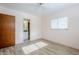 This bedroom has a light airy feeling with the tile floors and window at 5437 E Pinchot Ave, Phoenix, AZ 85018