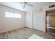 Bedroom featuring a ceiling fan, tiled floors and built in storage at 5437 E Pinchot Ave, Phoenix, AZ 85018