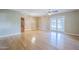 Large living room featuring light wood floors and sliding doors to the exterior at 5437 E Pinchot Ave, Phoenix, AZ 85018