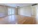 Open living room with hardwood floors and a sliding glass door at 5437 E Pinchot Ave, Phoenix, AZ 85018