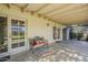 This covered patio area has a bench for sitting and shade from the Arizona sun at 5437 E Pinchot Ave, Phoenix, AZ 85018