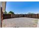 Rear yard featuring gravel ground cover and wood fence at 5504 N 69Th Ave, Glendale, AZ 85303