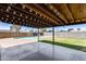 Beautiful backyard featuring a covered patio, sparkling pool, and a grass area, perfect for relaxing at 5504 N 69Th Ave, Glendale, AZ 85303
