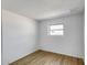 Bedroom with wood-look floors, fresh white walls, and ample natural light from window at 5504 N 69Th Ave, Glendale, AZ 85303