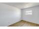 Clean and bright bedroom with wood-look floors, natural light, and fresh white walls at 5504 N 69Th Ave, Glendale, AZ 85303