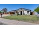 Well-maintained home with a green lawn, covered parking, and a charming pergola entry at 5504 N 69Th Ave, Glendale, AZ 85303