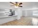 Modern kitchen features white cabinets, quartz countertops, and stainless steel appliances at 5504 N 69Th Ave, Glendale, AZ 85303