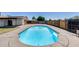 Inviting backyard pool surrounded by a concrete deck and wooden fencing at 5504 N 69Th Ave, Glendale, AZ 85303