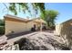 Private backyard featuring a pergola, air conditioner, and gravel ground cover, perfect for relaxation at 5521 W Northwood Dr, Glendale, AZ 85310