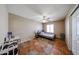 Bedroom with ceiling fan, ceramic tile flooring, and a small desk at 5521 W Northwood Dr, Glendale, AZ 85310