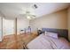 Bedroom with ceiling fan, ceramic tile flooring, and open space at 5521 W Northwood Dr, Glendale, AZ 85310
