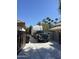 Paved driveway featuring a truck and RV, complemented by lush greenery and a clear blue sky at 5521 W Northwood Dr, Glendale, AZ 85310