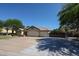 Beautiful single-story home showcasing a three-car garage and well-maintained landscaping at 5521 W Northwood Dr, Glendale, AZ 85310