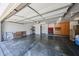 Spacious three-car garage with concrete floors and shelving for ample storage space at 5521 W Northwood Dr, Glendale, AZ 85310