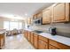 An inviting eat-in kitchen area with wooden cabinetry, modern appliances, and plenty of counter space at 5521 W Northwood Dr, Glendale, AZ 85310