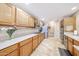 The bright kitchen features stainless steel appliances, granite countertops, and ample wooden cabinetry at 5521 W Northwood Dr, Glendale, AZ 85310